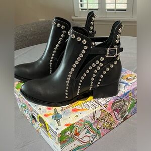 Black leather chrome studded booties.